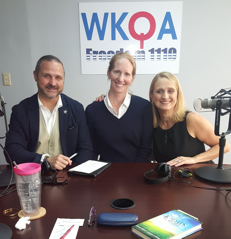 Matt and Libby Britton with Dr. Christine Bacon behind the microphones in the WKQA studios in Norfolk, Virginia.