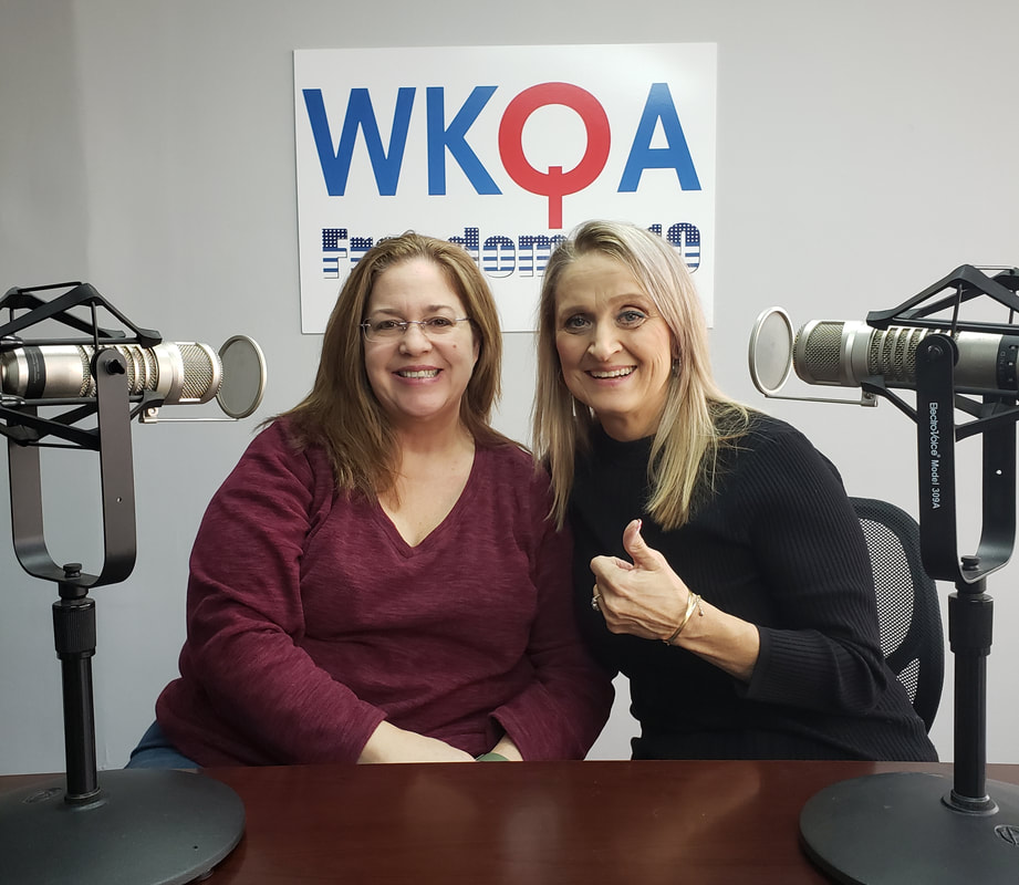 Drs. Sherry Wright and Christine Bacon sit behind the microphones in the WKQA studio.