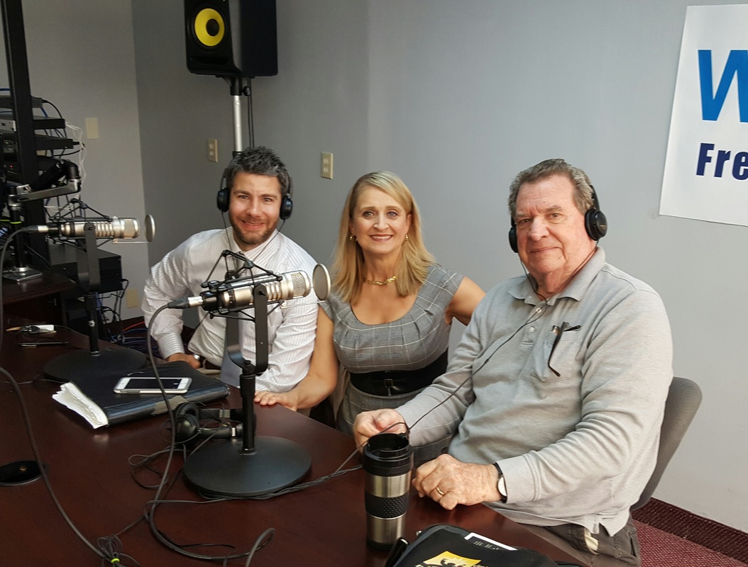 Dr. Christine Bacon, and guests Fred Watkins and Seth Doherty at the WKQA studio during a live show