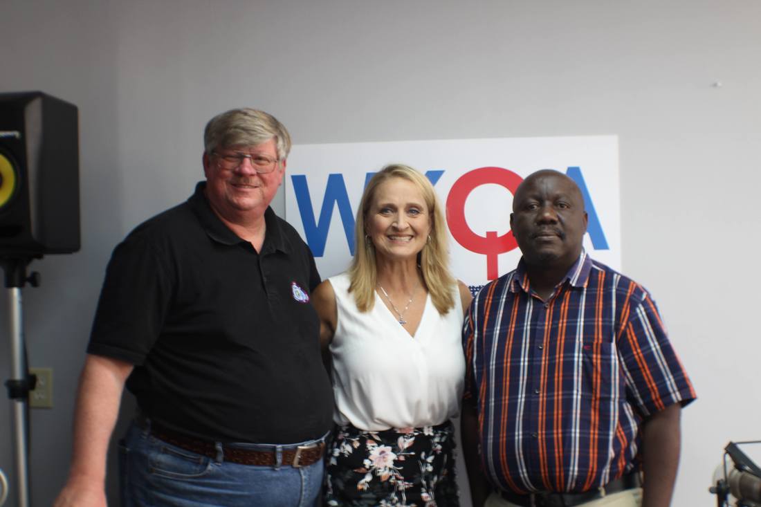 Fred and Darrell flank Dr. Christine Bacon in the studios of WKQA
