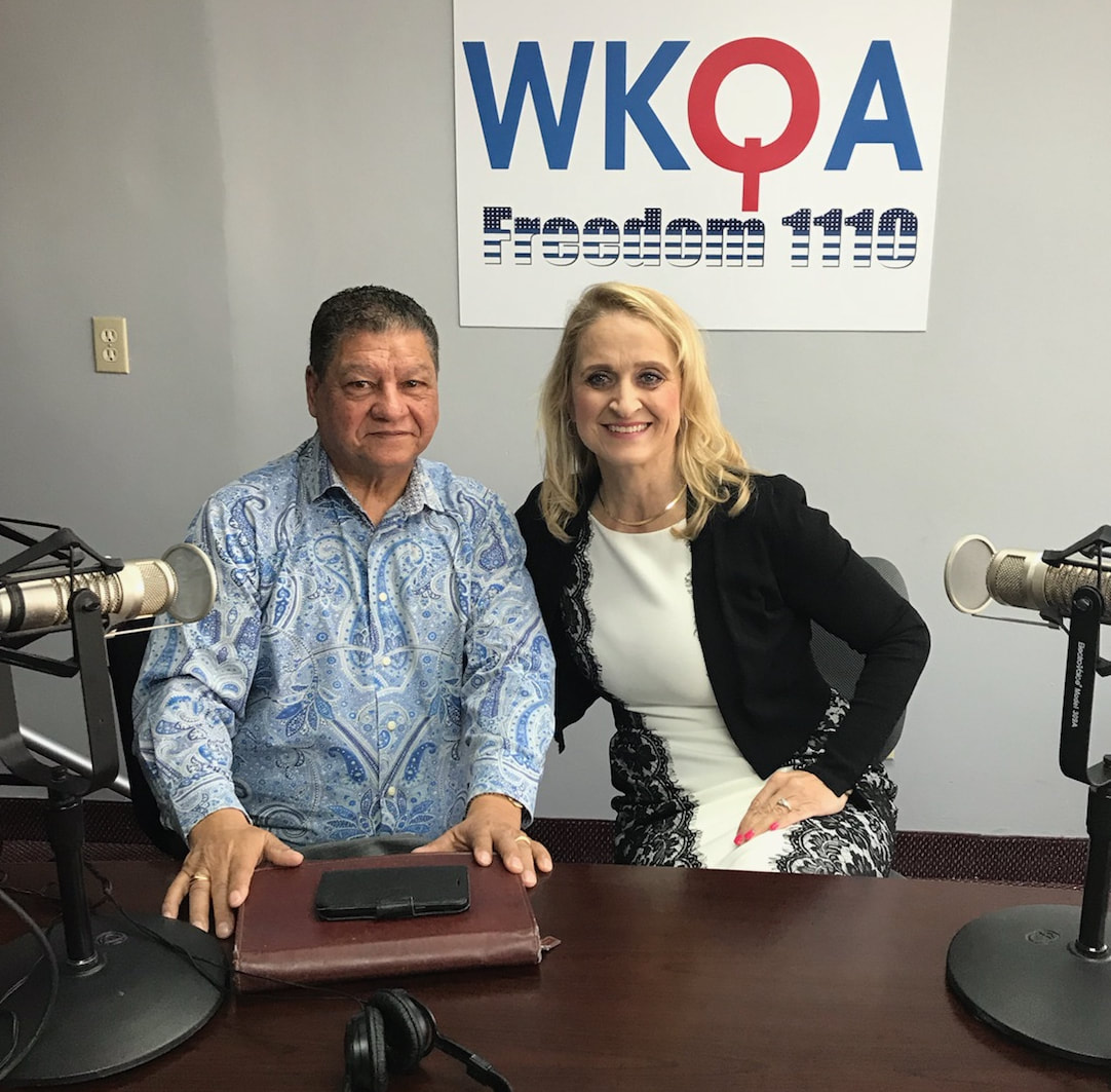 Dr. Christine Bacon and guest Newberry Hearne behind the radio desk at WKQA. 