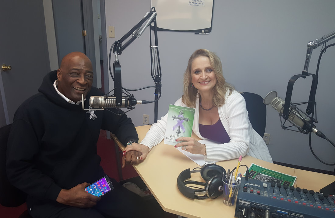 Rev. Aaron Wheeler and host Christine Bacon in the WKQA recording studios.