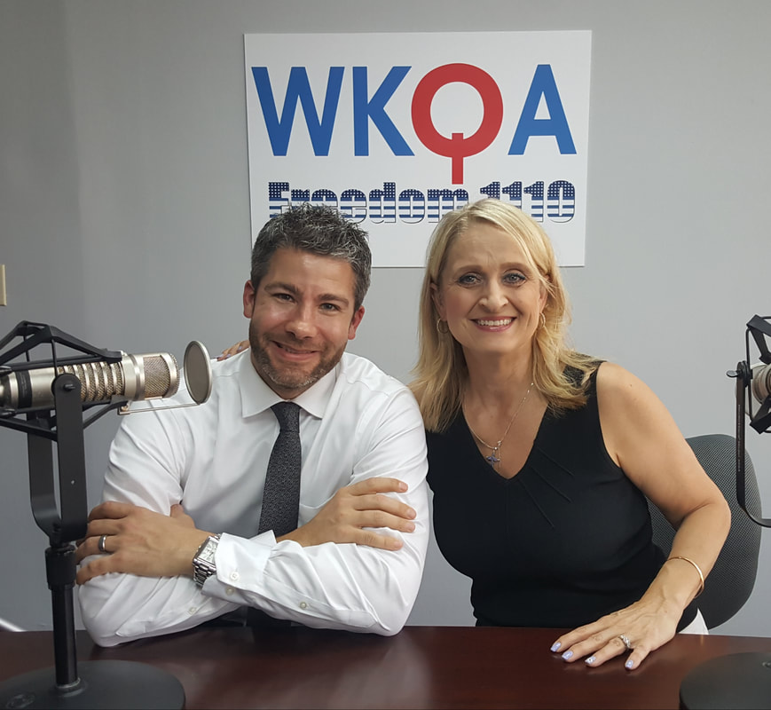 Dr. Christine Bacon and Seth Doherty behind the broadcast desk in the WKQA studios in Norfolk, Virginia.