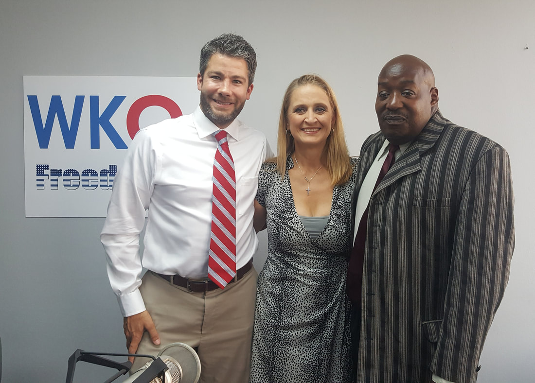 Guests Seth Doherty and Michael Armstrong with host Christine Bacon at the WKQA studios in Hampton Roads, Virginia.Picture