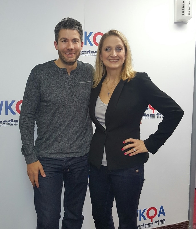 Seth Doherty pictured with Christine Bacon, Ph.D at WKQA radio studio in Norfolk, Virginia.