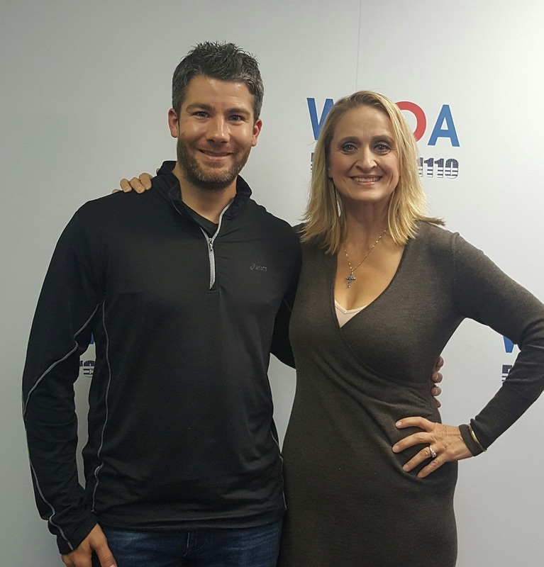 Guest Seth Doherty poses with Dr. Christine Bacon at the WKQA studios in Norfolk, Virginia.