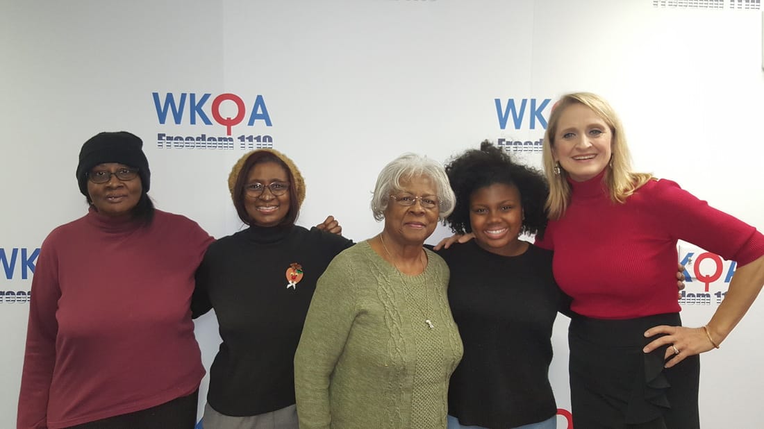 Three beautiful generations of Christian women snuggle with host Christine Bacon, Ph.D. at WKQA radio studio in Norfolk, Virginia.