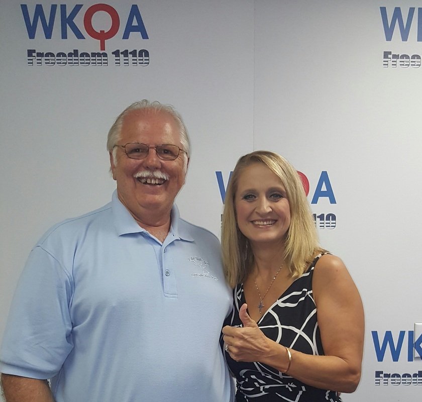 Guest Steve Mesznaros sharing a laugh with Dr. Christine Bacon at the WKQA studios in Norfolk, Virginia.