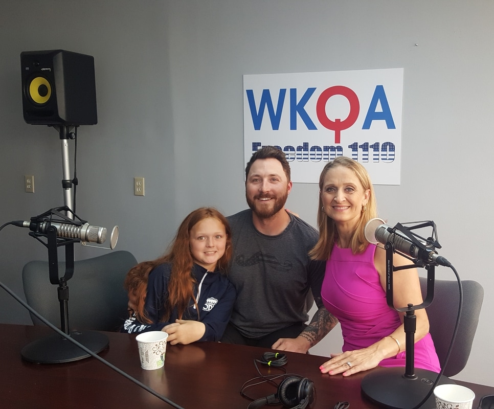 Guests Vernon Griffith II and his high-energy sidekick, daughter Carson, with host Dr. Christine Bacon in the WKQA studios in Norfolk, Virginia after a fun broadcast about the tournament they co-founded. Picture